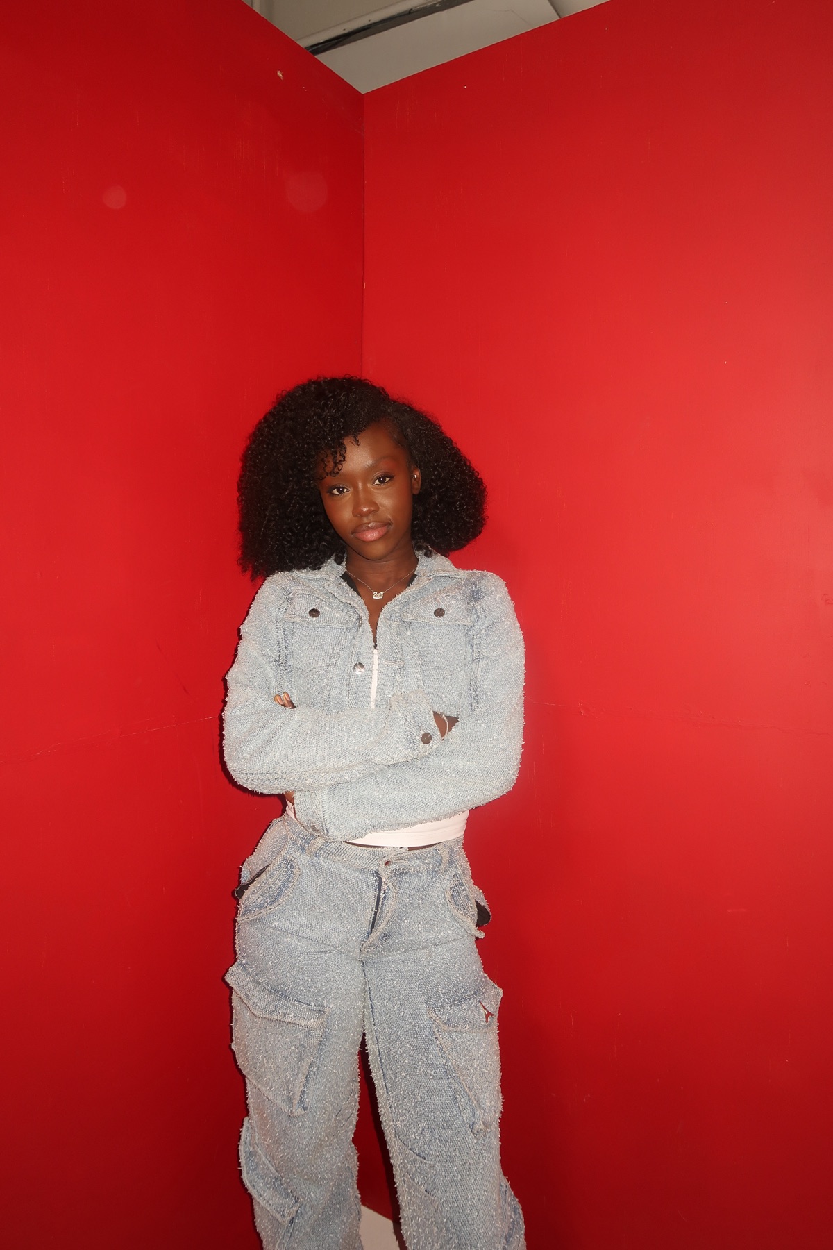 Portrait against a bold red backdrop